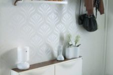 13 a modern IKEA Trones cabinet with a rich-colored wooden tabletop is a simple console for an entryway