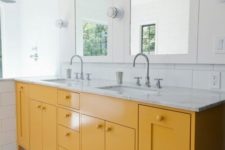 13 a sunny yellow vanity with cutouts is a simple yet stylish idea with a stone countertop