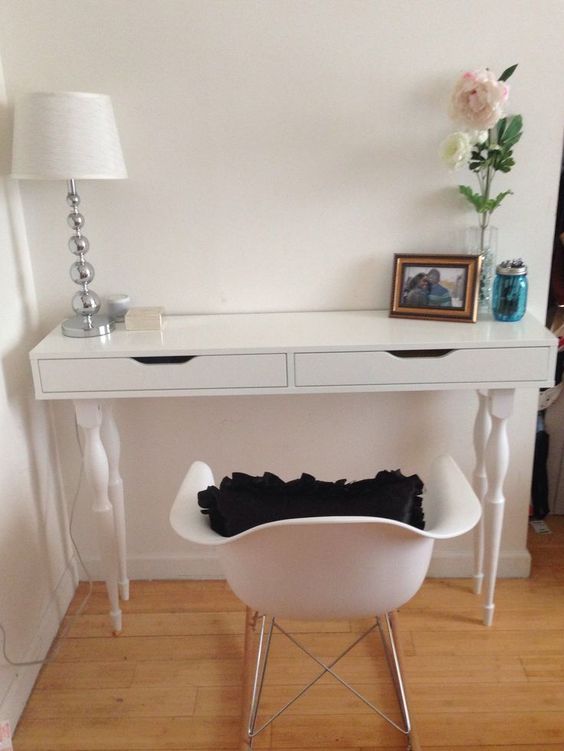an Ekby Alex shelf hacked into a vanity with vintage legs and a matching white chair for a little makeup nook