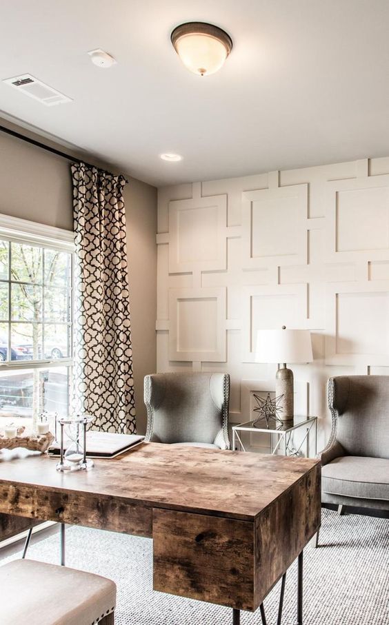 an elegant home office with a catchy plywood desk on hairpin legs with some storage units