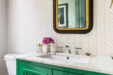 14 an emerald vanity with a white marble countertop is a chic and bright accent in the bathroom