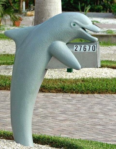 if it's a coastal home, why not consider having a dolphin holding your mailbox, it's fun and hints on the location
