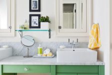 15 a green vanity and a bold yellow stool is an ultimate combo for a contemporary bathroom