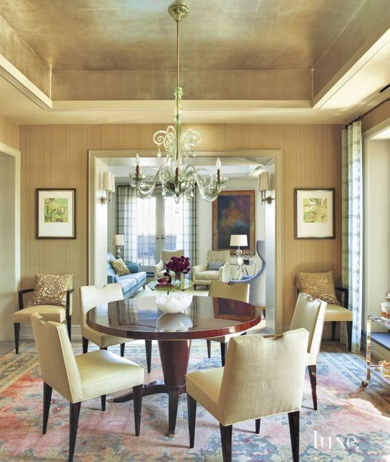 a neutral contemporary living room spruced up with a gold ceiling that adds shine to your space