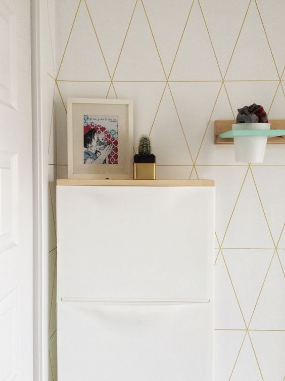 a simple IKEA Trones hack with a light-colored wooden tabletop makes up a floating console table