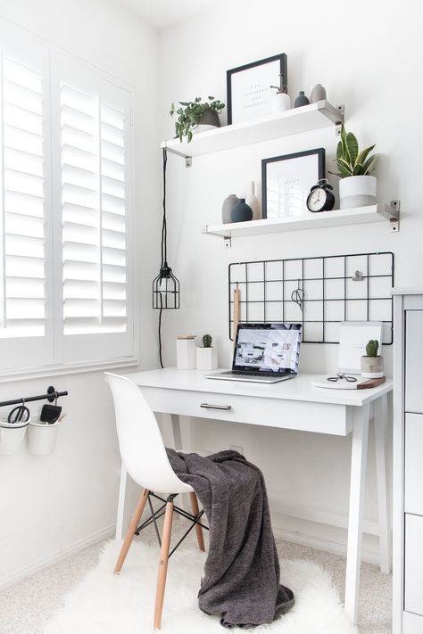 a small white sleek desk is a very stylish Scandinavian or minimalist option with a stroage drawer