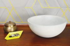18 matte grey tiles and neone yellow grout that brings color and pattern to the space at once