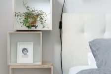 18 rock an arrangement of box-shaped floating nightstands by the bed, it’s a very whimsy idea