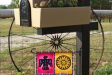 19 a gorgeous home mailbox with a cacti garden and a colorful Mexican-inspired banner
