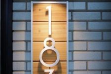 19 a modern house number sign of light-colored wood, white painted numbers and frame for a bold look