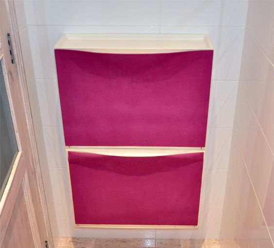 an IKEA Trones cabinet spruce up with hot pink fabric is a stylish idea to go for