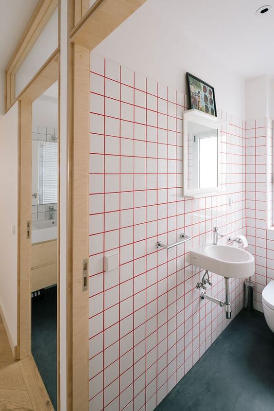 bright pink grout and white tiles for a modern and bold look in your bathroom