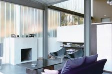 23 a chic contemporary living room with a corrugated ceiling with metal beams that contrast the furniture