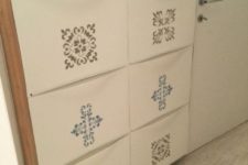 24 an IKEA Trones shoe cabinet spruced up with colorful stickers and with a wooden waterfall countertop for an entryway