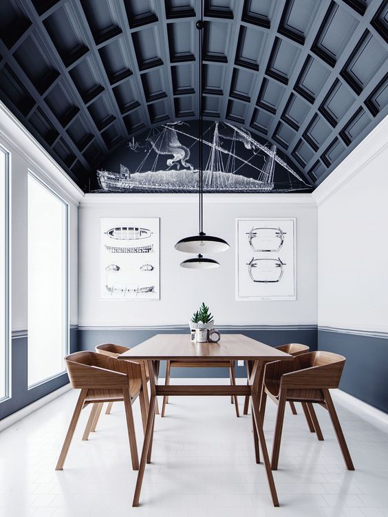 an arched ceiling done with black paneling takes over the whole space and makes a statement