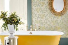 25 an oval yellow bathtub brigns color to the space, and makes a statement in this bathroom