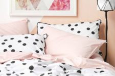 25 large polka dots with a black edge and pink bedding set for a playful feel in a girlish room