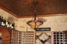 26 a home wine cellar spruced up with a pressed tin ceiling that gives a chic and vintage feel to the space