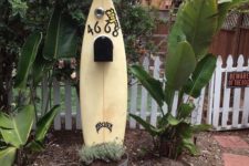 26 use your old surfboard to display a mailbox – place it into a planter, write your house numbers and attach the box