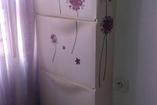29 spruce up IKEA Trones cabinets with purple floral stickers to give them a girlish feel