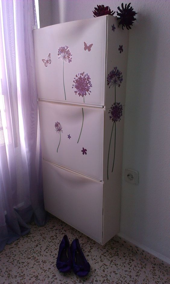 spruce up IKEA Trones cabinets with purple floral stickers to give them a girlish feel