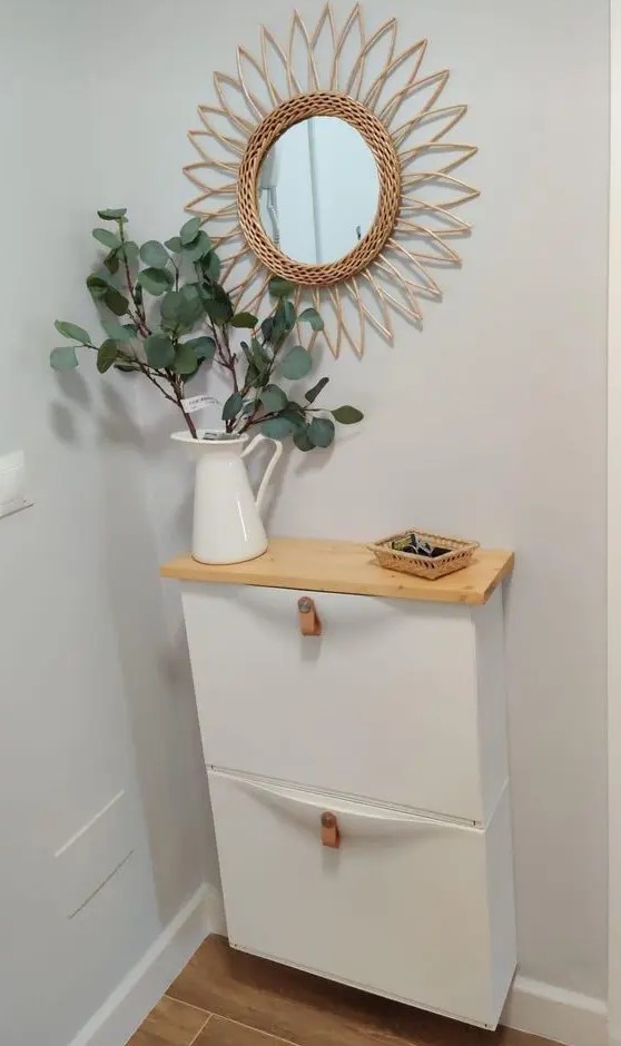 a small IKEA Trones piece with leather pulls and a stained countertop is a lovely idea for a small entryway