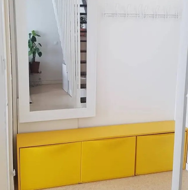 a yellow IKEA trones piece is a cool idea for an entryway, it will make a statement with color
