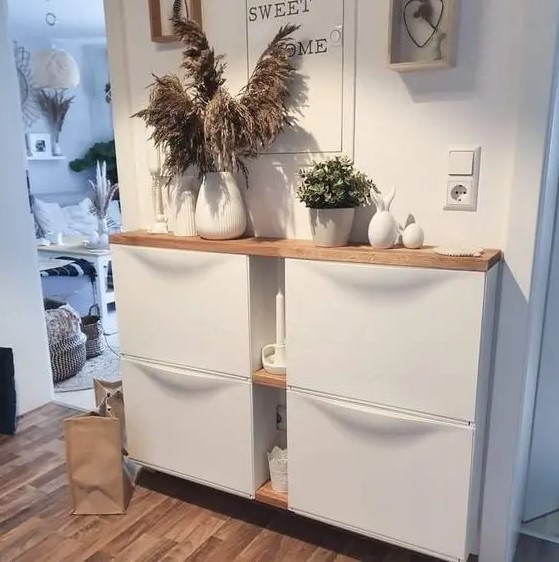 an IKEA Trones hack with additional shelves between the pieces and a common stained countertop is a lovely idea for a boho space