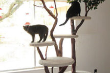 02 a classic-looking cat tree of branches and trunks and round platforms covered with fabric will inspire your cats to jump