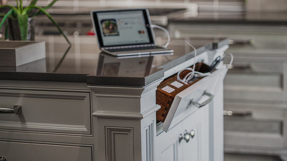 a drawer in your kitchen island is a tiny charging station that can be hidden anytime you don't need it