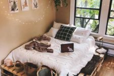 06 a cozy pallet bed with storage space inside and on top – some baksets and lamps can be accommodated here