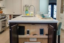 10 a whole charging station integrated into the kitchen island end – close the doors and you won’t see it