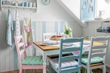 15 a vintage-inspired dining nook with pastel chairs of the same design and touches of powder blue