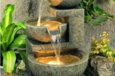 17 a cool lit up bowl water feature like this one looks modern enough and adds light and sound to your front yard