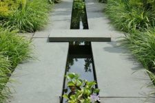 18 such a modern feature with dark grey stone, black water and bright green plants brings symmetry and organic textures