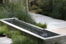 19 a contemporary water feature with a mini fountain surrounded with grasses will harmonize your front yard