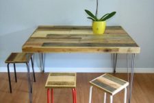 19 a rustic dining table with a pallet wood tabletop on hairpin legs and some matching stools
