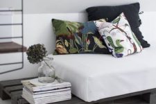 24 a dark stained pallet daybed with a comfy mattress and printed pillows is a cool idea for a living room