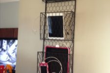 24 a wore basket hanging on the wall is ideal to charge your tablets and phones and can be hung anywhere