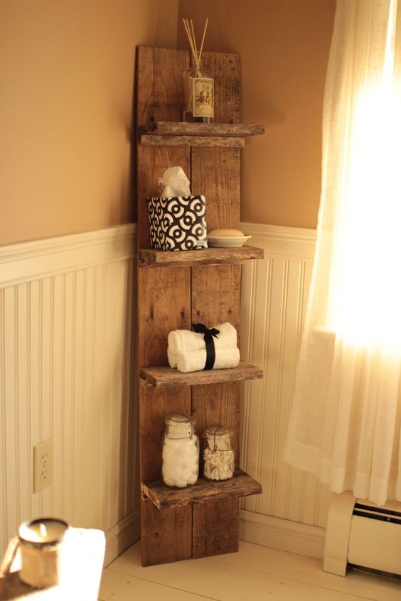 a sleek bathroom shelf with several tiers for bathroom stuff and towels is a stylish idea for a rustic bathroom