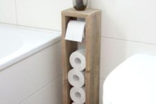 26 a sleek toilet paper roll holder with some storage space on top is a great for a bathroom with lack of space