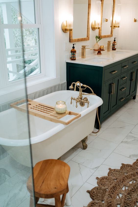 stylish eclectic bathroom done in neutrals, with a black vanity, a free-standing bathtub and a shower space