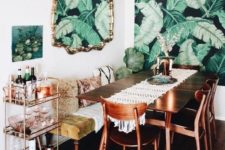 02 a dining room with a tropical leaf print wallpaper wall and a matching artwork on the next wall for an accent