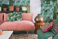 03 a bright living room with tropical leaf print wallpaper and matching pillows plus colorful furniture