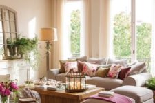 03 a cozy and welcoming living room with ivory as the main color, tan as the secondary one and pink for accents