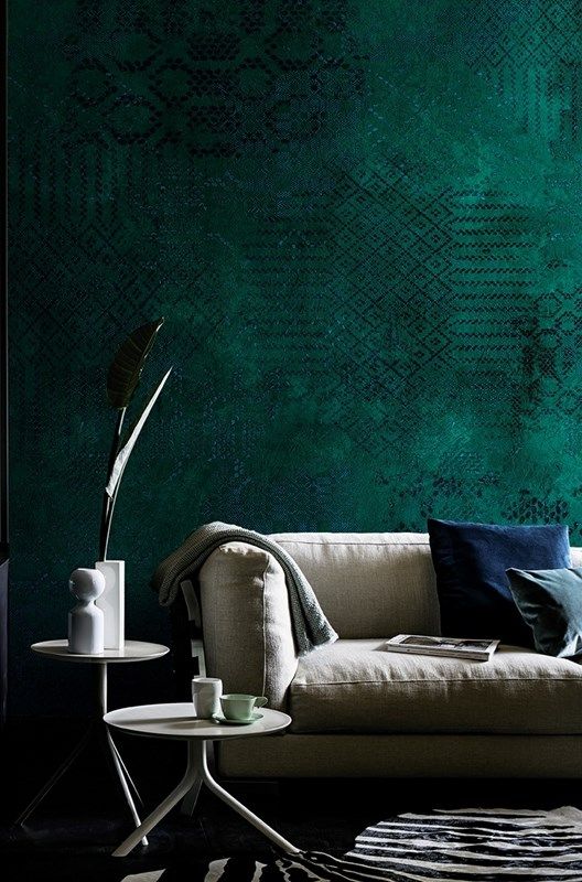 emerald green textural wallpaper here brings a cozy feel with its color and texture