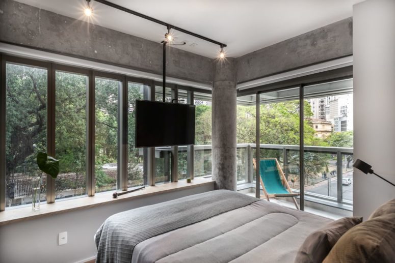 The master bedroom is done with concrete, there's a pillar and two glazed walls plus an access to the corner balcony The master bedroom is done with concrete, there's a pillar and two glazed walls plus an access to the corner balcony