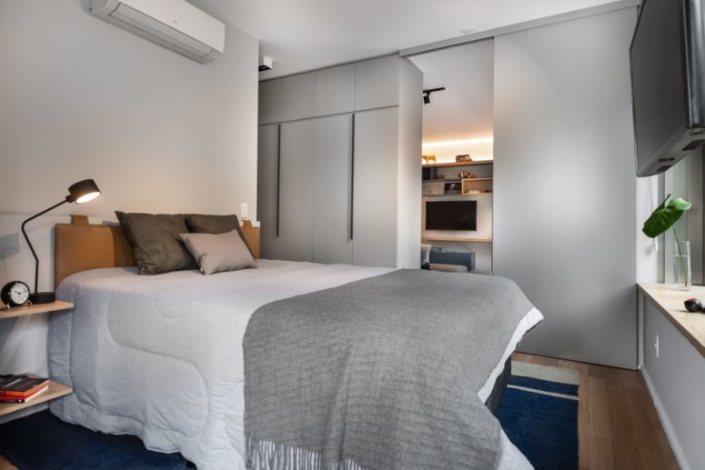 a contemporary bedroom with cool nightstands The second bedroom features a comfy leather upholstered bed, much storage and floating nightstands