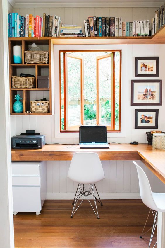 https://www.digsdigs.com/photos/2019/04/05-wall-mounted-open-shelves-plus-an-L-shaped-shared-desk-will-maximize-functionality-and-let-you-work-comfortably.jpg