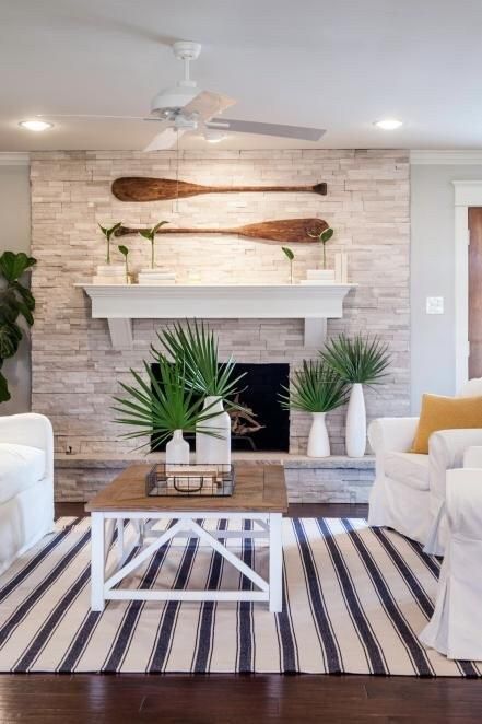 a coastal living room done in tan, beige tones and much white plus a brown floor